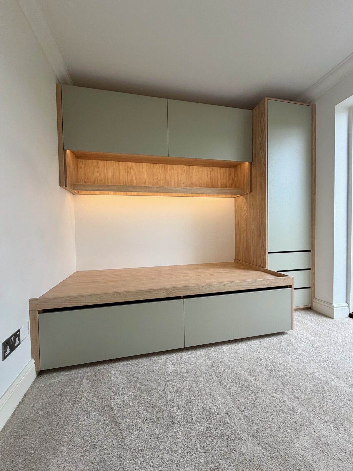 Bespoke children’s bed with under-bed drawers, overhead cupboards and fitted bedroom storage in Teddington